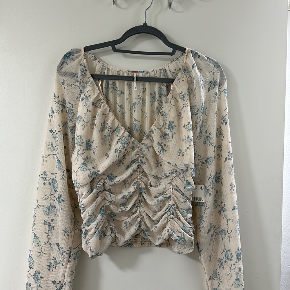 Brand new never used Free People blouse. Floral fabric
